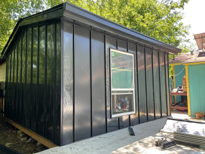 Black standing seam metal wall panels for Roof Inspection in Midwest City