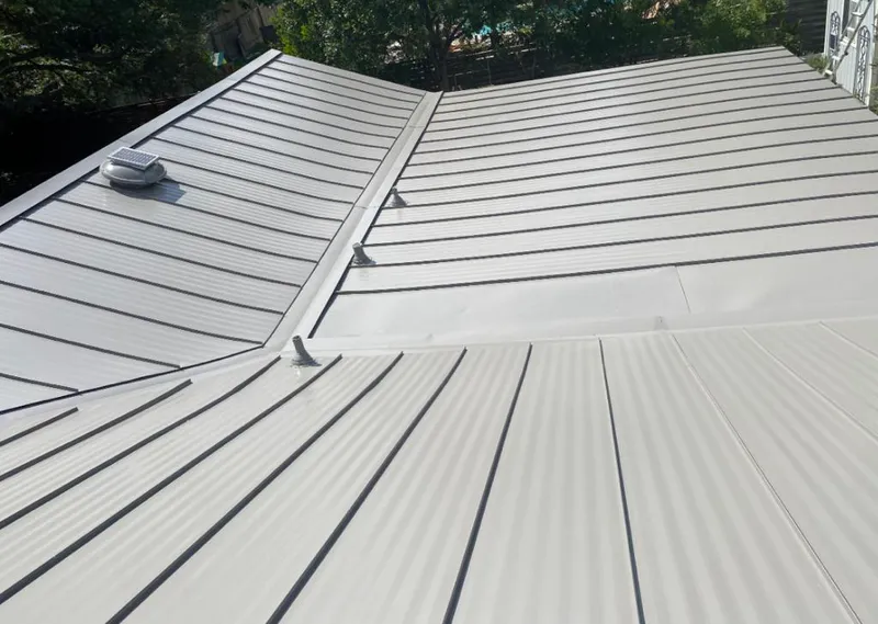 Solar attic fan installed on a metal roof for Roof Ventilation in Midwest City